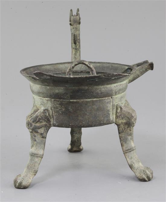 A Chinese archaic bronze tripod ritual wine-warming vessel, Jiao Dou, Southern & Northern dynasties, 6th century A.D., 31cm long, 22cm